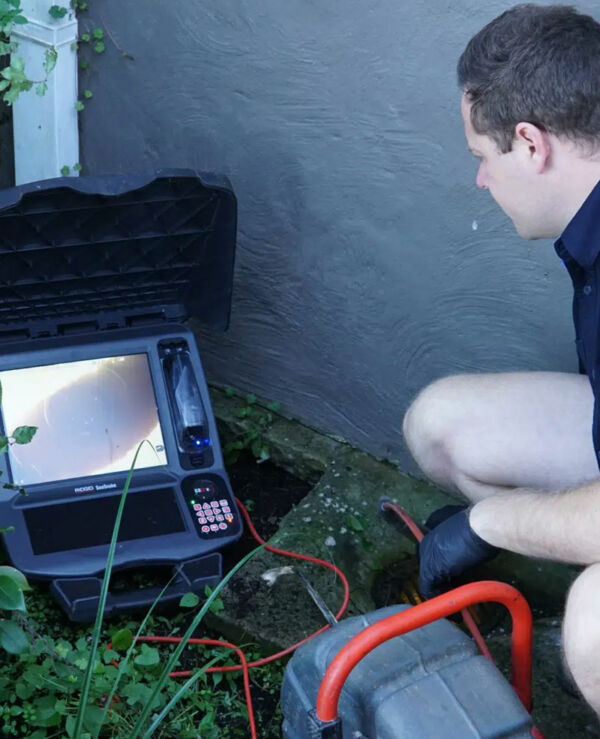 A plumber detecting a hidden water leak